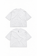 YAKCA CORE pure white oversized T-shirt, plain front and small vertical black YAKCA logo centred on the upper back